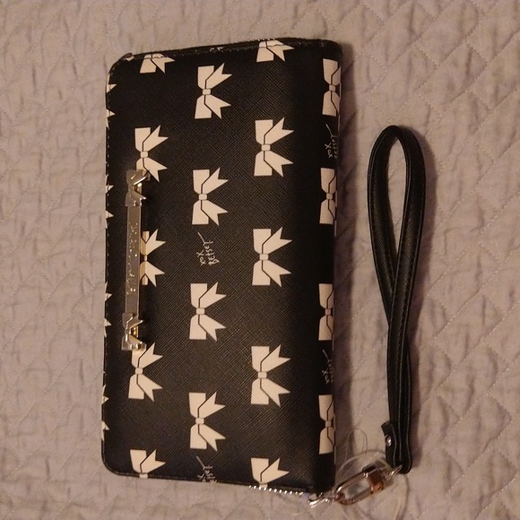 Betsey Johnson Handbags - NWOT Betsey Johnson White Bow Black Background. Hot Pink Inside.